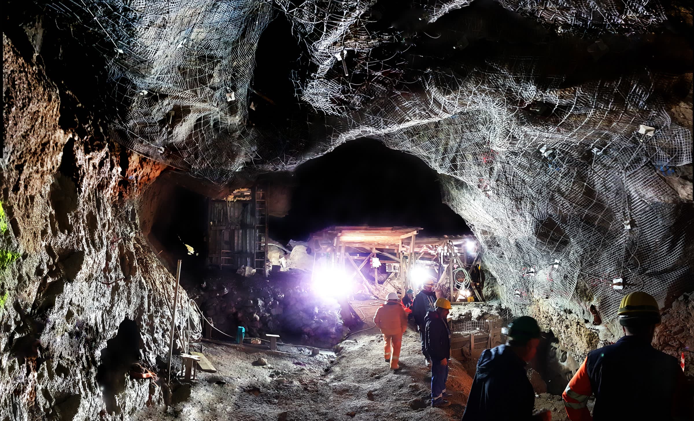 Supported underground rock excavation illustrating hard-rock mining conditions
