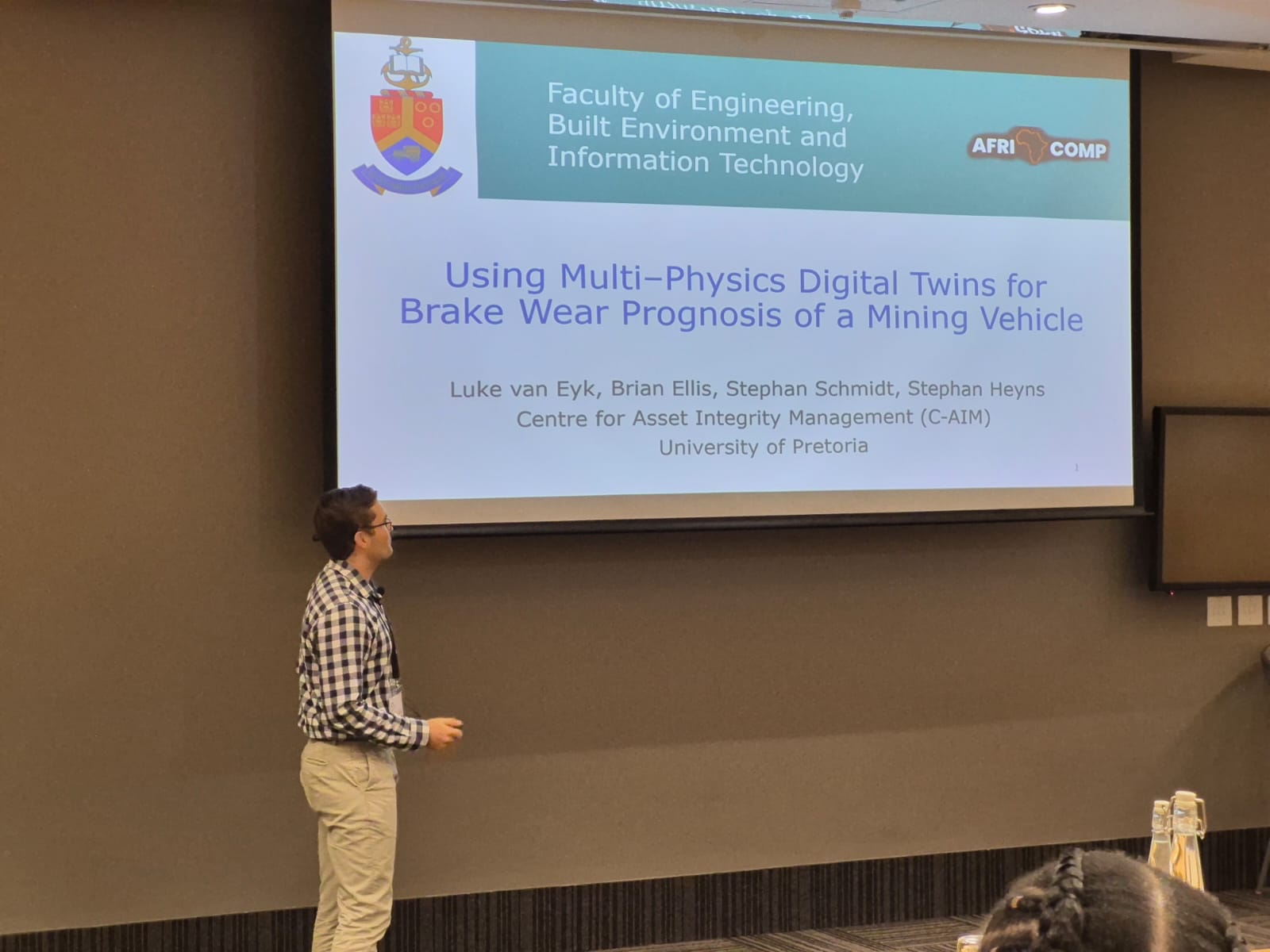 Luke van Eyk presenting the AFRICOMP 2026 digital-twin and brake-wear research title slide