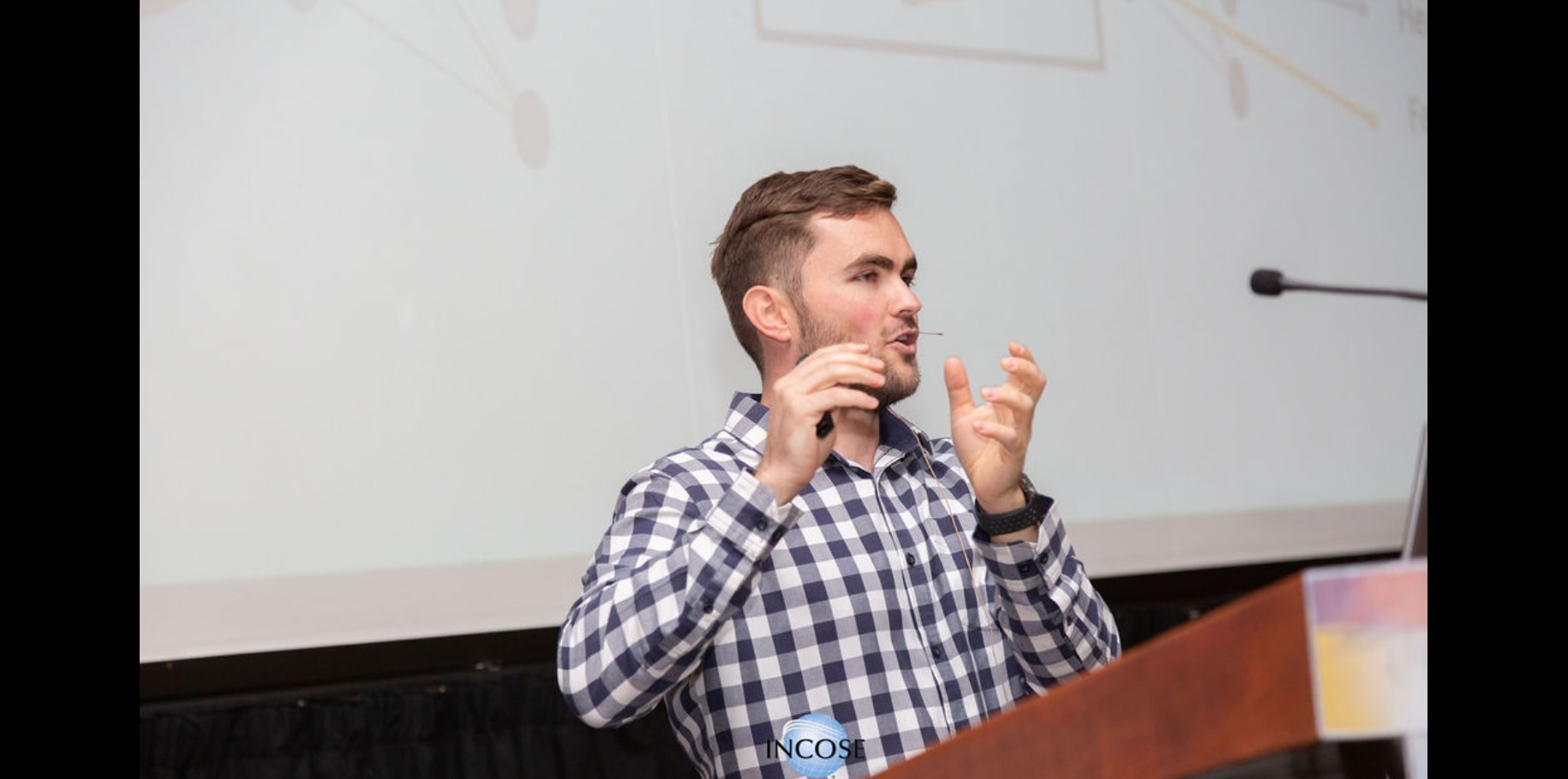 Luke van Eyk speaking during the INCOSE 2024 keynote session
